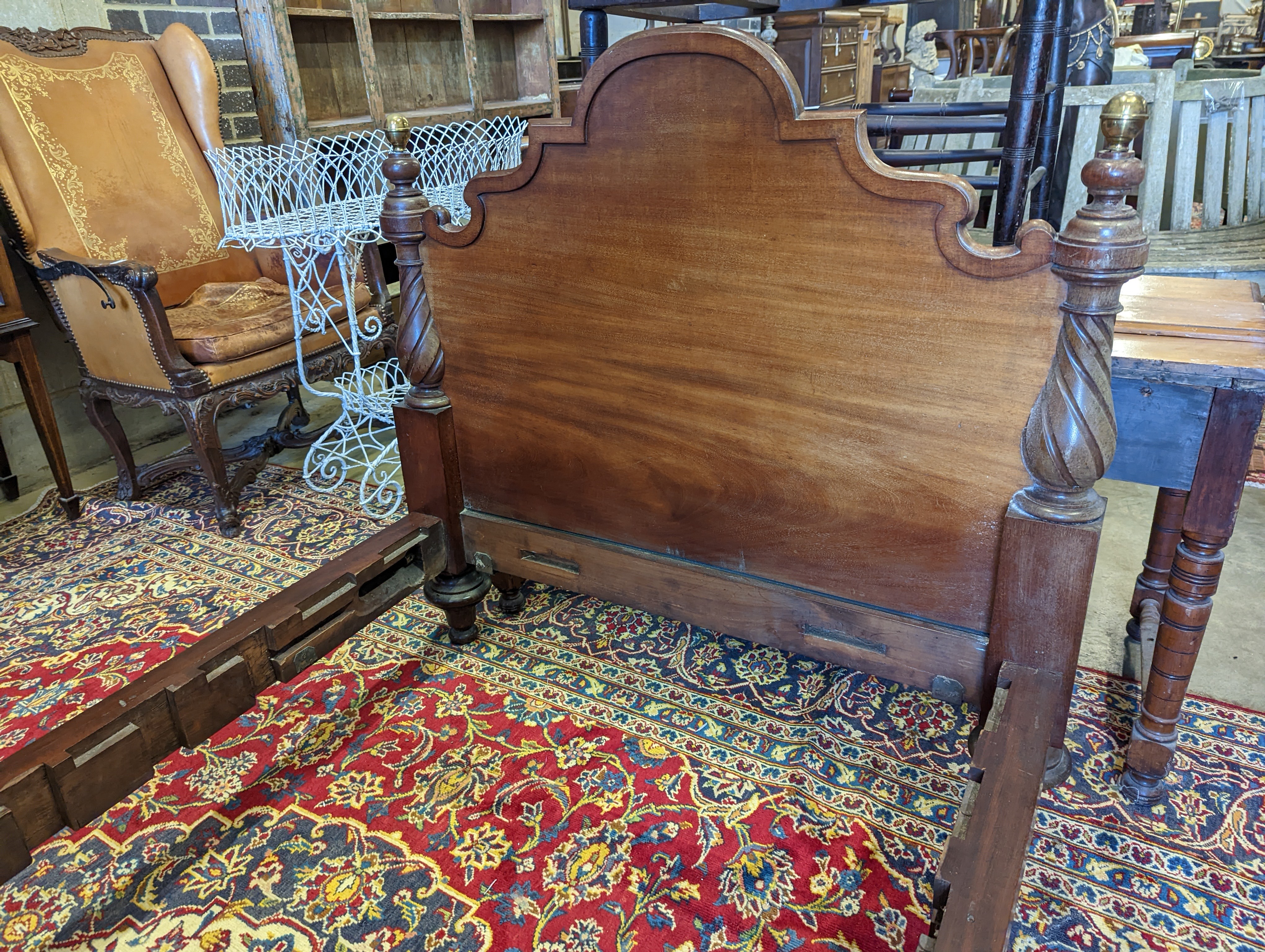 A pair of Victorian mahogany single bed frames, length 210cm, width 107cm